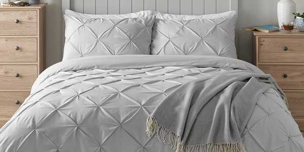 Grey bedding with diamond quilted design.